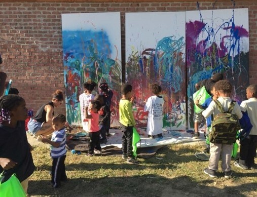 Children creating a mural
