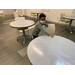 boy wiping a table with a wet paper towel